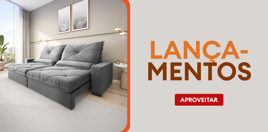 Sofá cinza moderno em sala de estar bem iluminada com decoração minimalista, ideal para ambientes aconchegantes e elegantes.